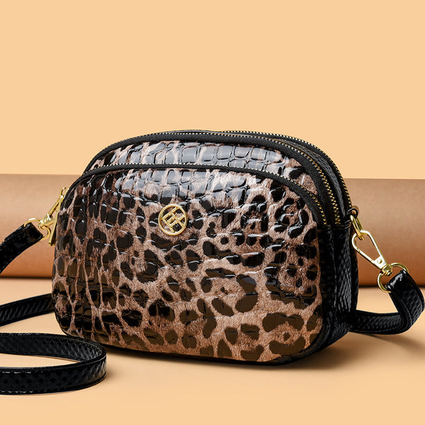Cartera amimal print redonda