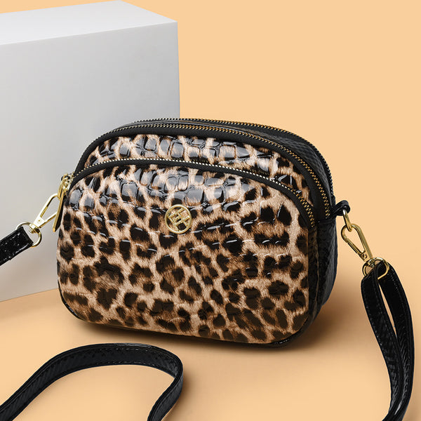 Cartera amimal print redonda